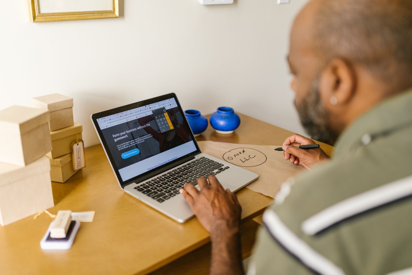 A supplier reviewing an order on a laptop